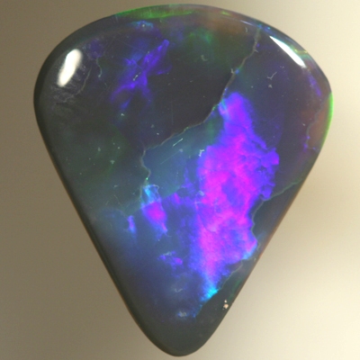 SOLID BLACK OPAL Two large rolling flashes of neon greens to ultra violet. SEE VIDEO